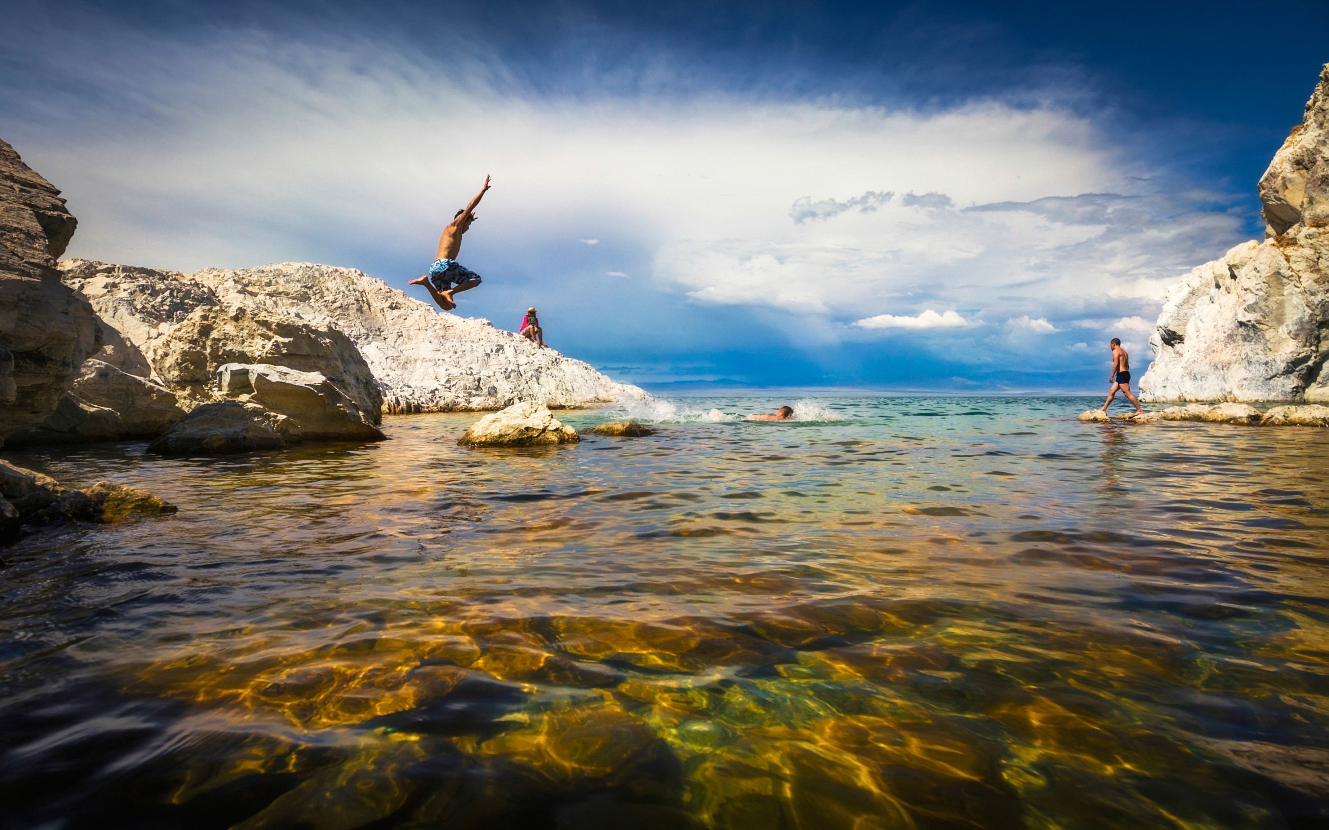 Mongolian horseman herding livestock at golden hour on the steppe